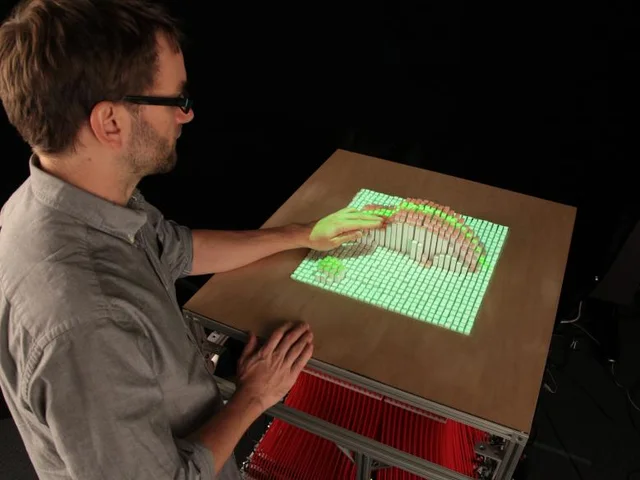 MIT inFORM’s actuated pin surface in a physical interaction demonstration.